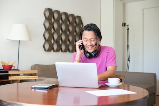 A person working from home with a laptop and coffee