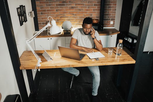 A person sitting at a desk with a tired expression while working from home