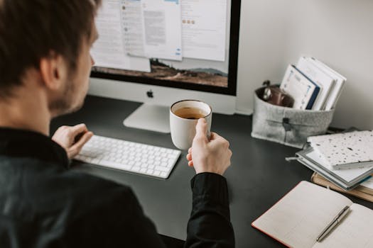 a person taking a break with a cup of tea